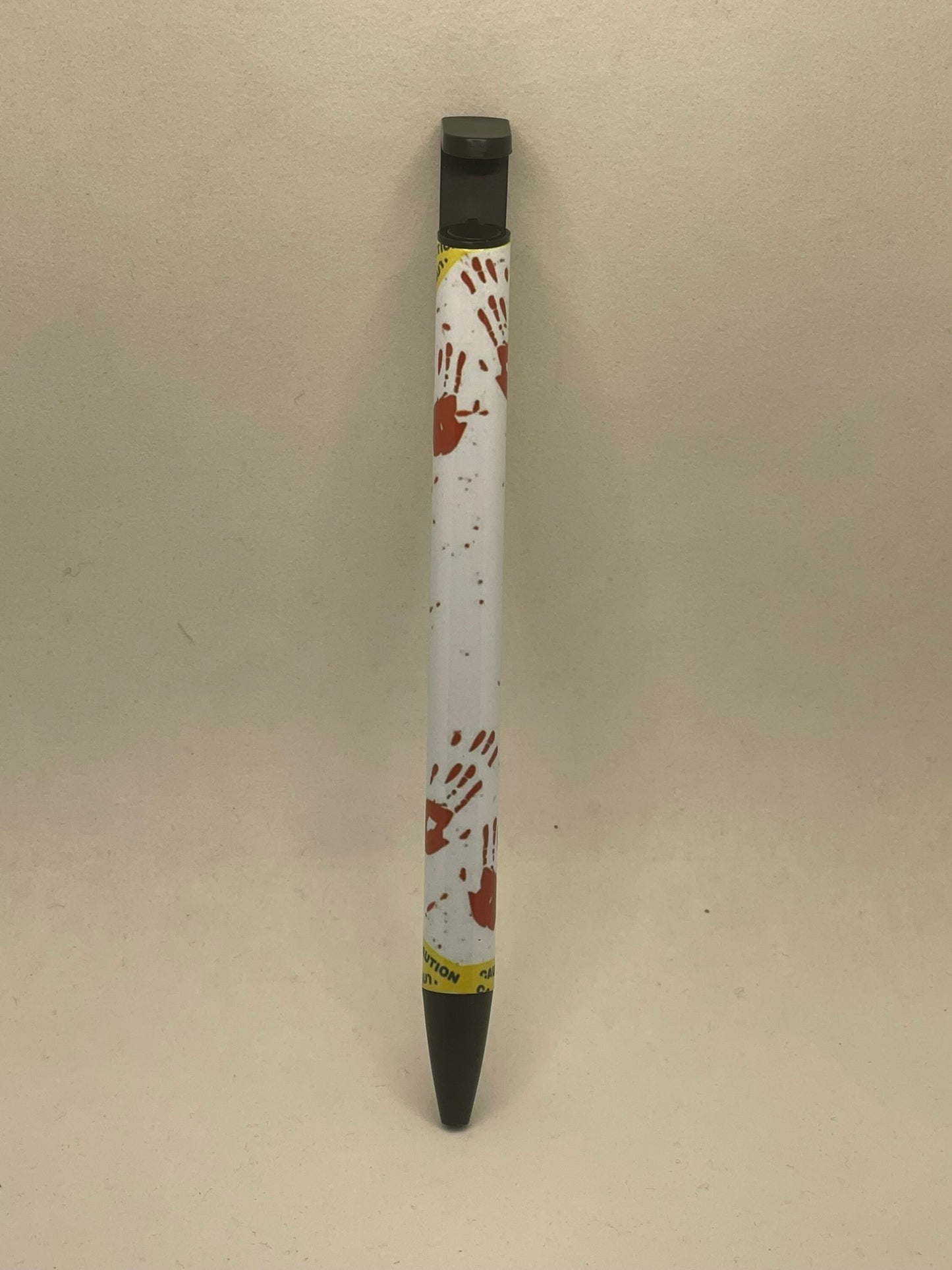 Crime scene pen with phone stand