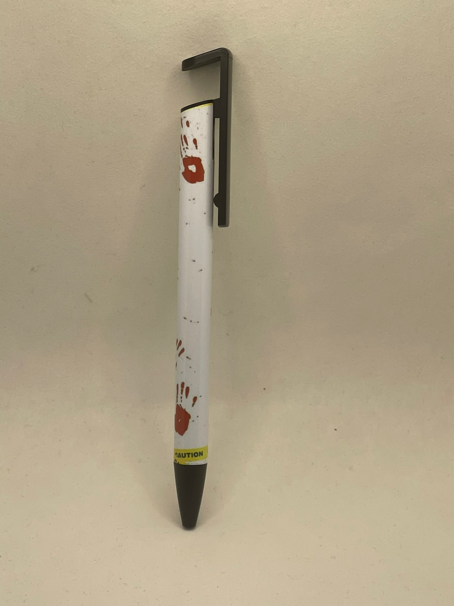 Crime scene pen with phone stand