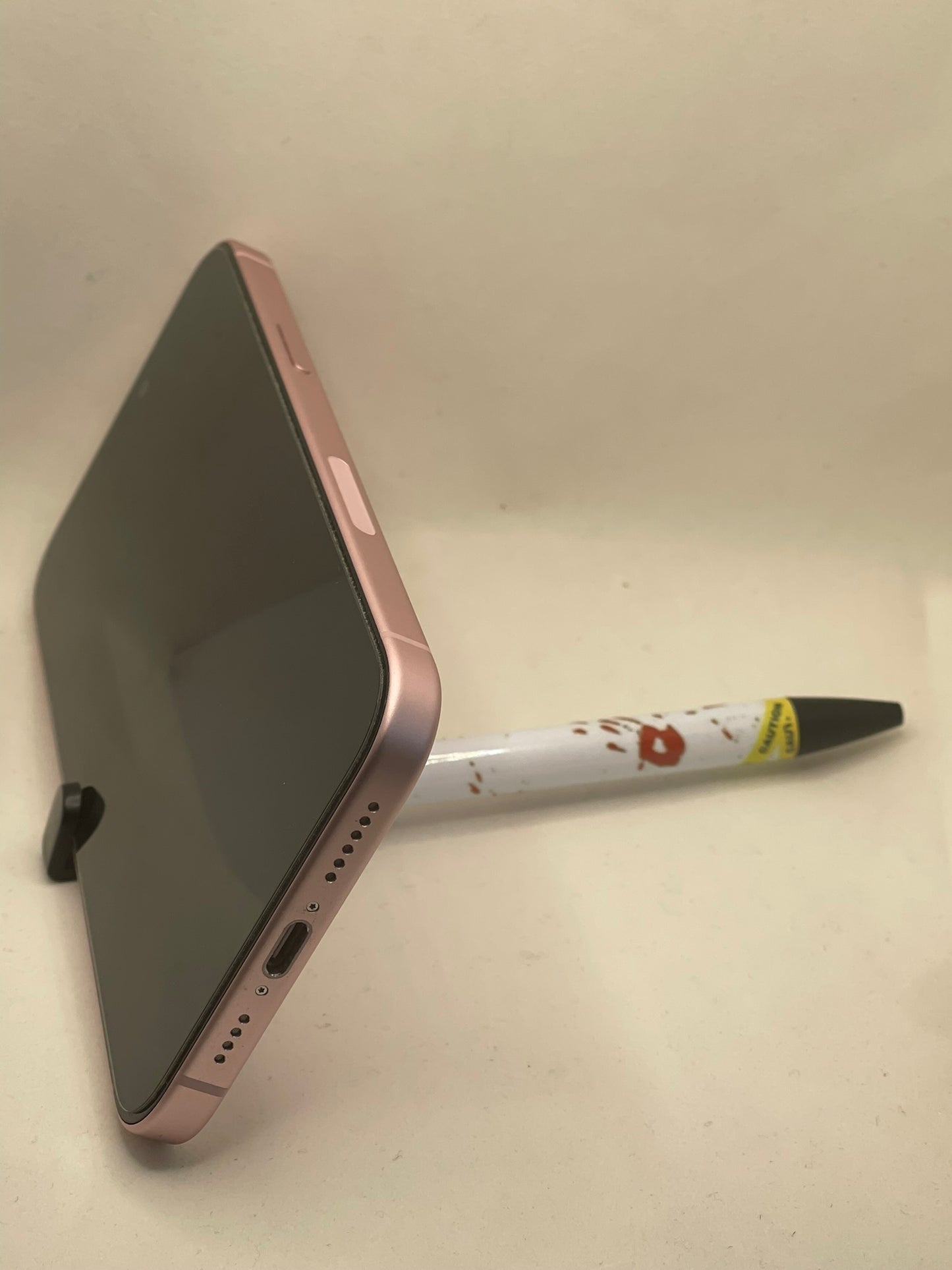 Crime scene pen with phone stand